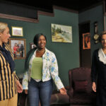 blond woman wearing a navy and tan striped jacket, african american woman wearing jeans, green shirt and floral jacket, older woman wearing a navy blue suit with a large white collar- running mates